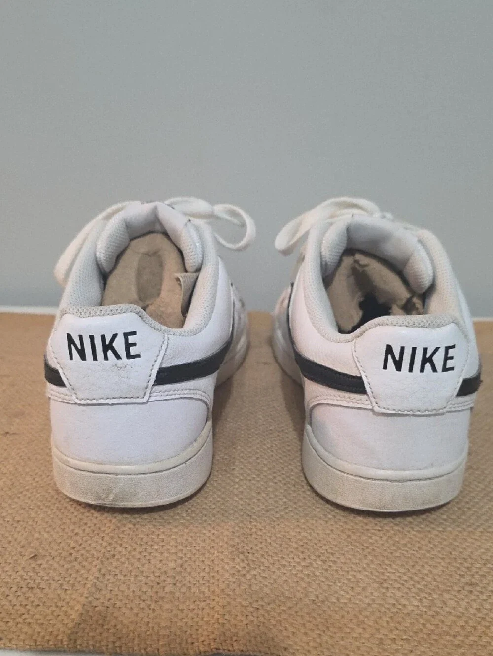 Nike White Men's Low-Top Sneakers with Black Swoosh